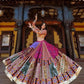 A woman gracefully twirling in a colorful Navratri Lehenga Choli, featuring intricate mirror work, rich embroidery, and a voluminous flair, perfect for Garba and festive celebrations.