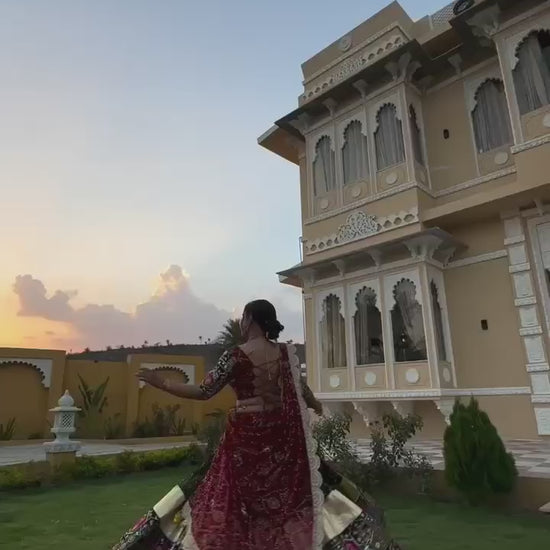 A vibrant traditional Navratri Gujarati lehenga with intricate mirror work and a canvas patta border is showcased. The lehenga features a stunning combination of black, red, and yellow hues with a 4-meter flair. The video captures the detailed embroidery, rich fabric textures, and elegant drape of the outfit, highlighting its festive appeal.